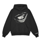 Front view of a black unisex relaxed fit pullover hoodie with a front pocket, featuring a grey and white smiling mouth graphic with a star on one tooth printed across the chest. The right sleeve is detailed with white “Alterego” text near the cuff.