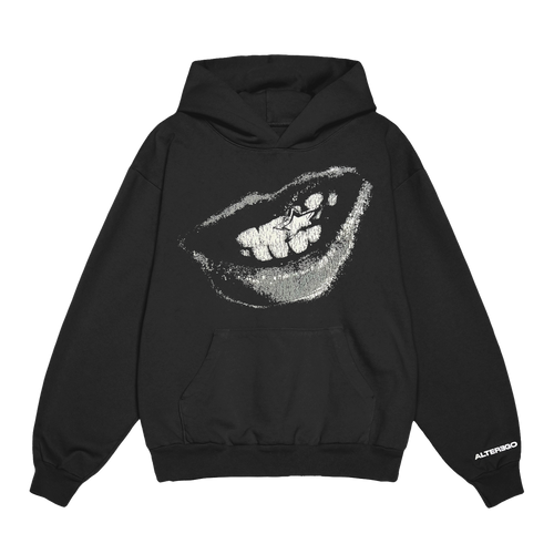 Front view of a black unisex relaxed fit pullover hoodie with a front pocket, featuring a grey and white smiling mouth graphic with a star on one tooth printed across the chest. The right sleeve is detailed with white “Alterego” text near the cuff.